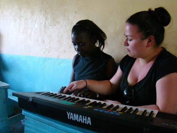 Stacey gives Lilian a music lesson