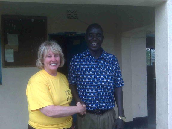 Peter Nyamohanga Maroa, Chairman of the Board (Kuria tribe) receives visitor at Petals